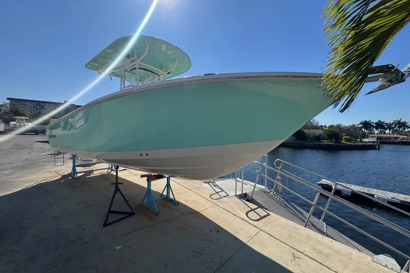 Slide: The Image of 2023 Sea Chaser 27 HFC CC boat on display by the waterfront. - 4