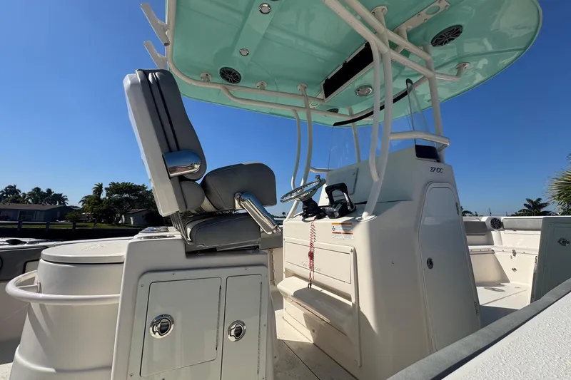 Slide: The Image of 2023 Sea Chaser 27 HFC CC boat interior with helm and seating. - 9