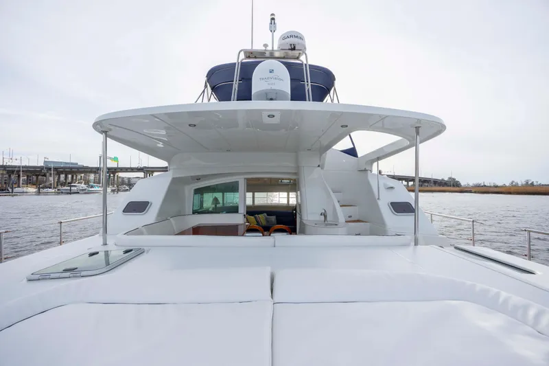 Slide: The Image of 2004 Lagoon 43 PC yacht with spacious deck and modern design on the water. - 13