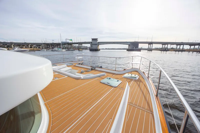 Slide: The Image of Lagoon 43 PC 2004 yacht deck with scenic waterfront and bridge view. - 19