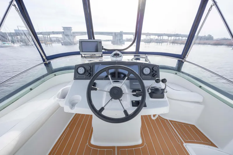 Slide: The Image of Helm of 2004 Lagoon 43 PC yacht with modern controls and panoramic view. - 28