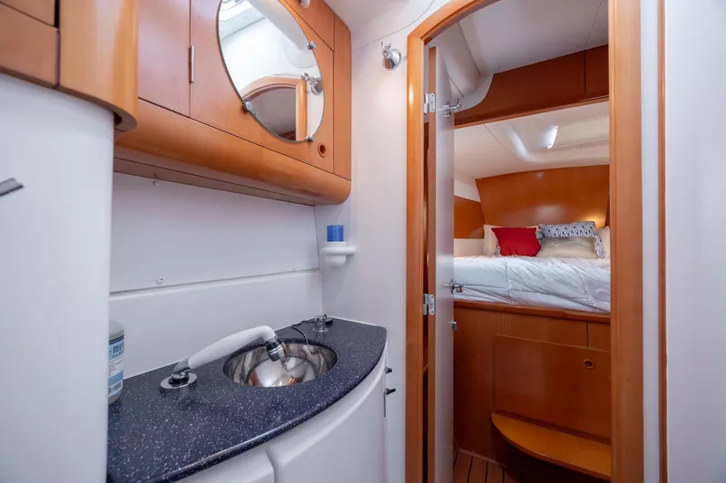 Slide: The Image of Luxurious interior of 2004 Lagoon 43 PC yacht with cozy bedroom and modern bathroom. - 52