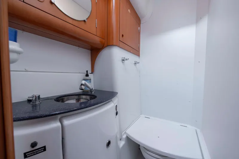 Slide: The Image of Bathroom interior of 2004 Lagoon 43 PC yacht with sink and toilet. - 58