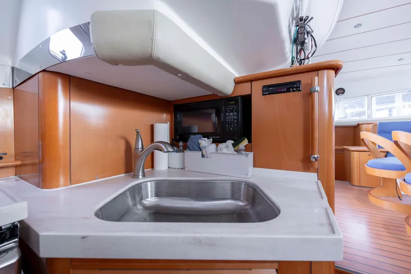 Slide: The Image of Luxurious kitchen interior of 2004 Lagoon 43 PC yacht with modern amenities. - 62
