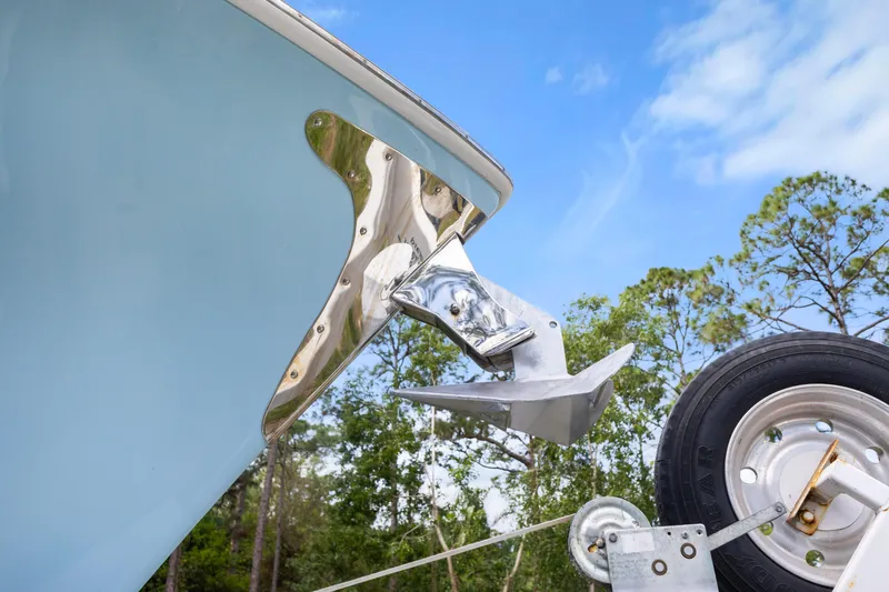 Slide: The Image of 2016 SeaHunter 41 Tournament boat bow with anchor and trailer, set against a clear sky. - 16