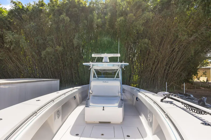 Slide: The Image of 2016 SeaHunter 41 Tournament boat with Garmin equipment, surrounded by lush greenery. - 22
