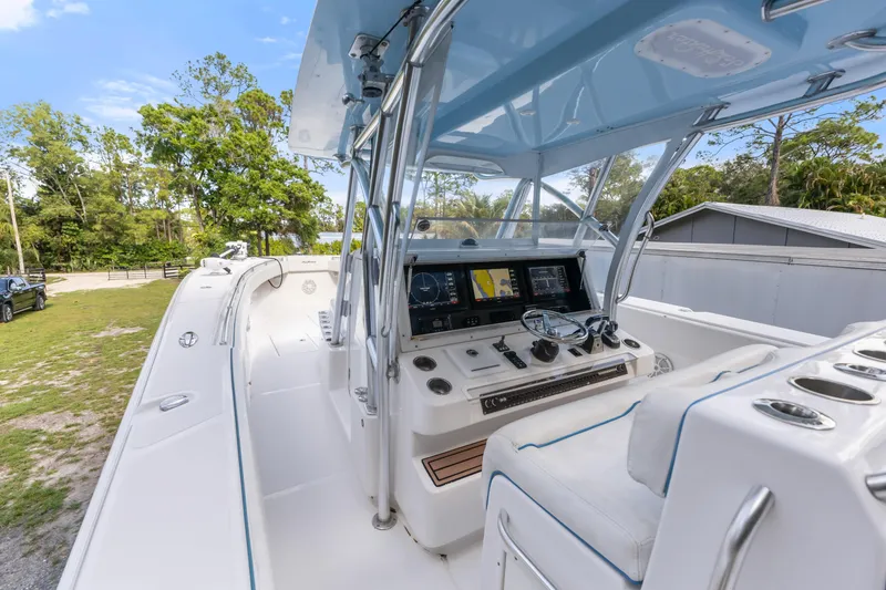 Slide: The Image of 2016 SeaHunter 41 Tournament boat cockpit with modern navigation system and sleek design. - 30