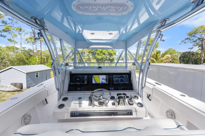 Slide: The Image of 2016 SeaHunter 41 Tournament boat cockpit with advanced navigation system and sleek design. - 33