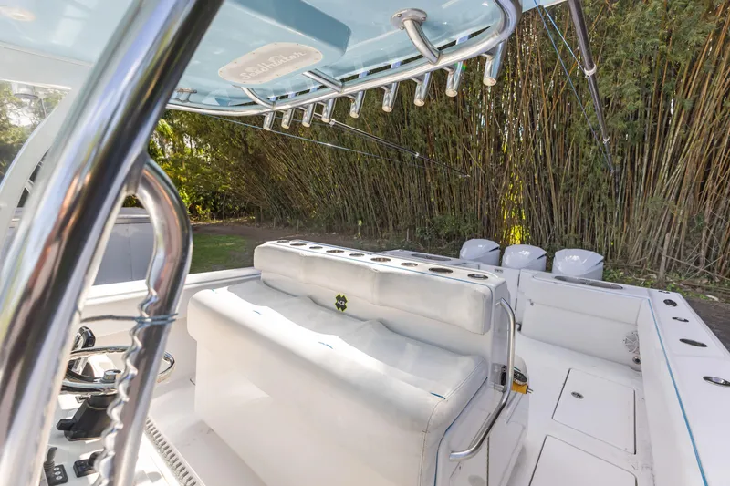 Slide: The Image of 2016 SeaHunter 41 Tournament boat interior with seating and fishing rod holders. - 38