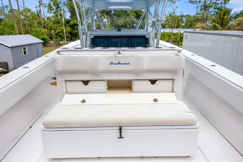 Slide: The Image of 2016 SeaHunter 41 Tournament boat interior with storage compartments and seating. - 43
