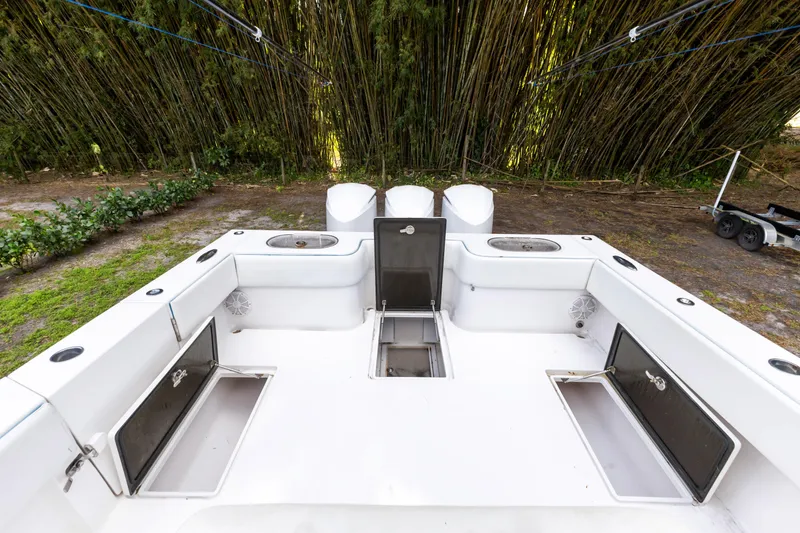 Slide: The Image of 2016 SeaHunter 41 Tournament boat deck with storage compartments and fishing rod holders. - 49