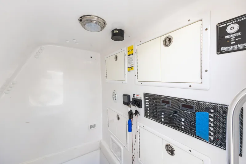Slide: The Image of Interior view of 2016 SeaHunter 41 Tournament boat with control panels and storage compartments. - 55