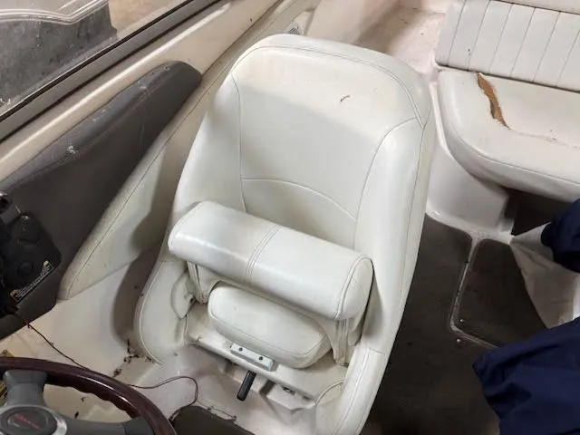 Slide: The Image of Interior of a 2006 Regal 1900 Bowrider with white seating. - 10