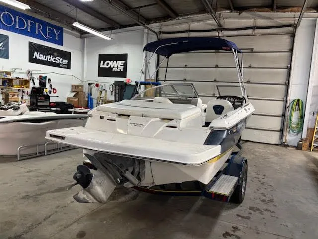 Slide: The Image of 2006 Regal 1900 Bowrider boat in a workshop. - 3