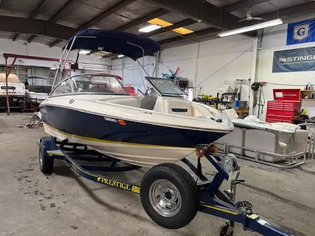 Slide: The Image of 2006 Regal 1900 Bowrider boat on a trailer in a workshop. - 4