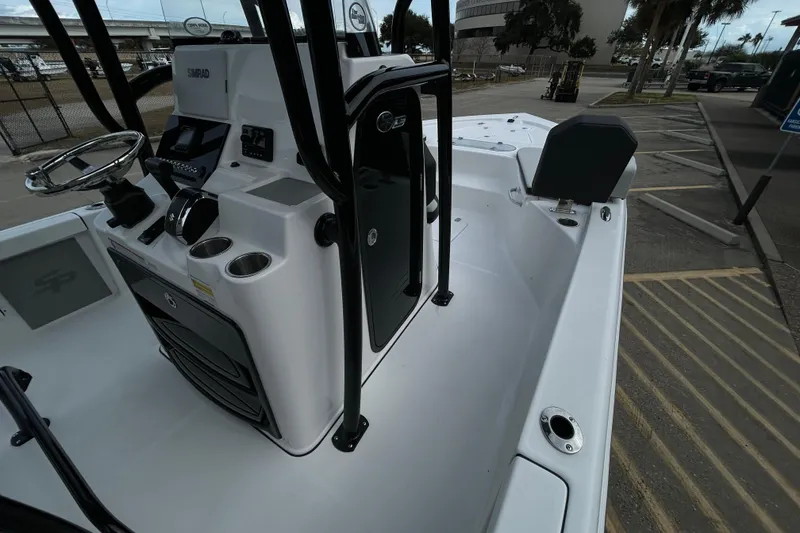 Slide: The Image of 2026 Sea Pro 250 Bay boat interior with steering console and seating area. - 11