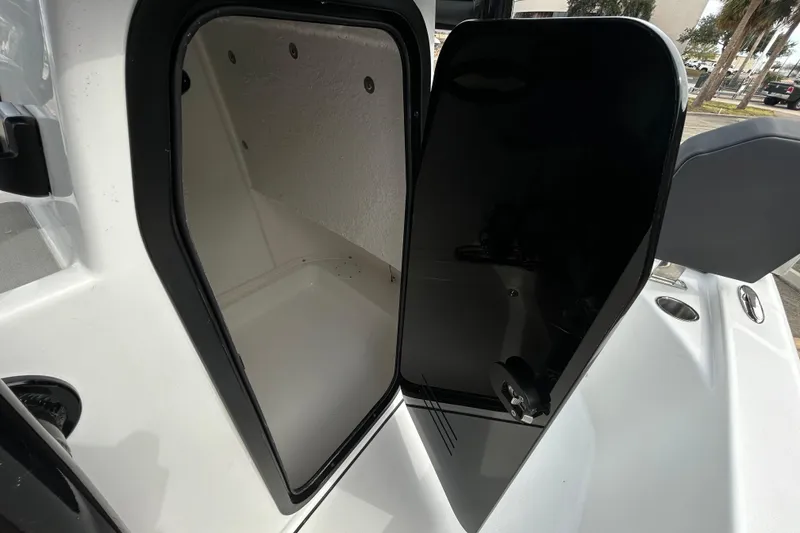Slide: The Image of Open storage compartment on a 2026 Sea Pro 250 Bay boat, showcasing interior space. - 16