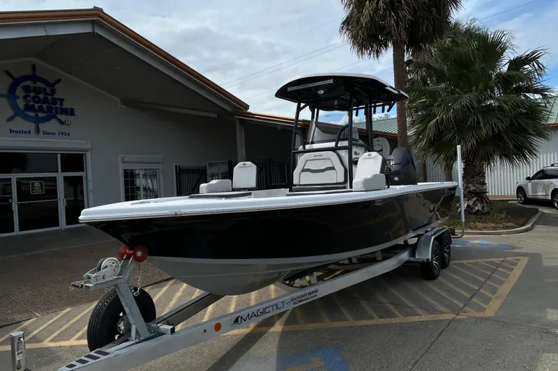 Slide: The Image of 2026 Sea Pro 250 Bay boat on trailer at Gulf Coast Marine dealership. - 2