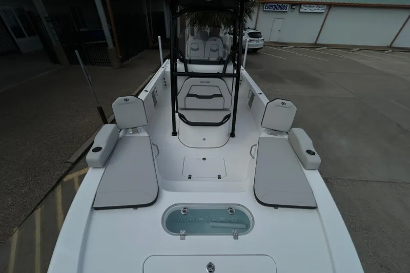 Slide: The Image of 2026 Sea Pro 250 Bay boat interior with seating and storage compartments. - 20