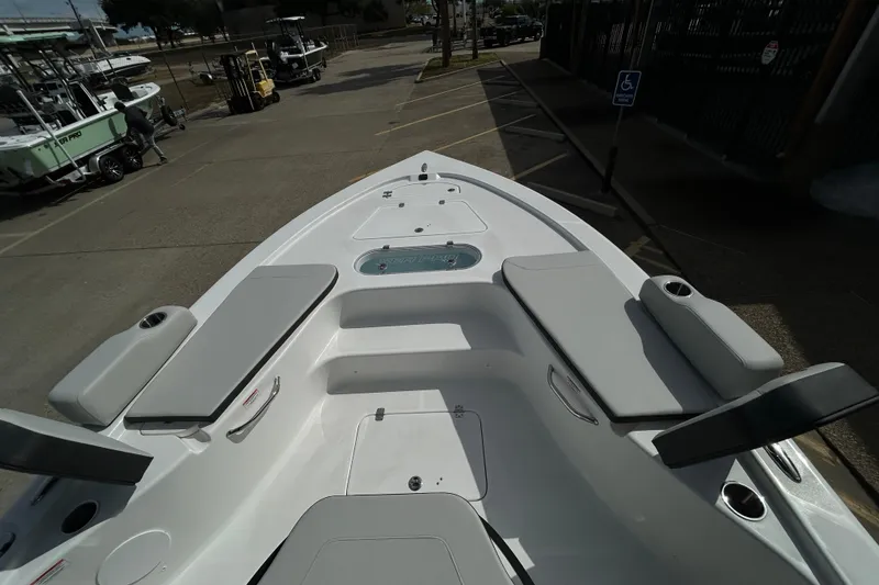 Slide: The Image of 2026 Sea Pro 250 Bay boat interior with seating and storage compartments. - 21