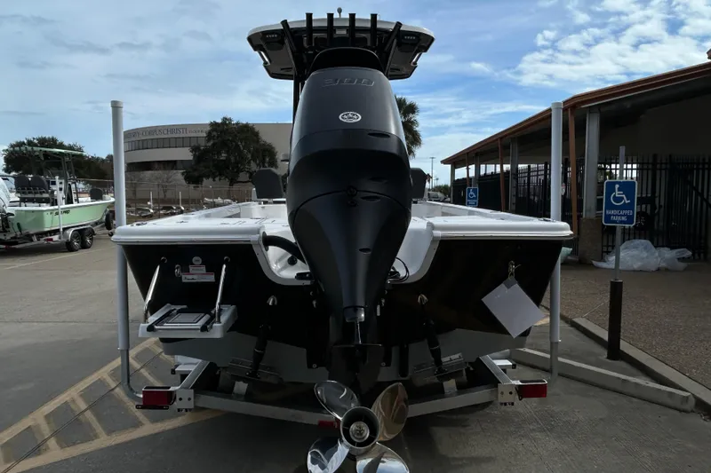 Slide: The Image of 2026 Sea Pro 250 Bay boat on trailer, rear view with outboard motor. - 3