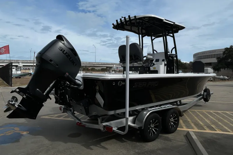 Slide: The Image of 2026 Sea Pro 250 Bay boat with Suzuki outboard motor on a trailer. - 7