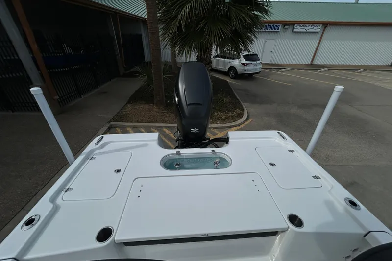 Slide: The Image of 2026 Sea Pro 250 Bay boat with outboard motor in parking lot. - 8