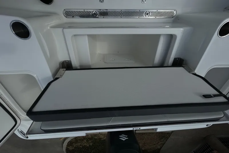 Slide: The Image of 2026 Sea Pro 250 Bay boat storage compartment with open hatch. - 9