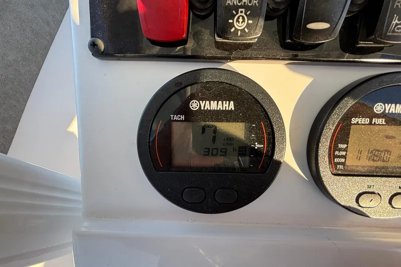 Slide: The Image of Yamaha tachometer and speed fuel gauges on 2026 Sea Hunt Ultra 219 boat dashboard. - 11