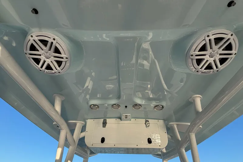 Slide: The Image of 2026 Sea Hunt Ultra 219 boat speakers and roof detail against clear sky. - 13
