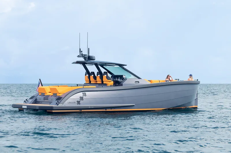 Slide: The Image of 2024 Lekker 44 luxury yacht cruising on open water with sleek design and vibrant seating. - 11