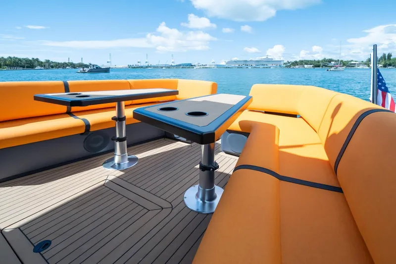 Slide: The Image of Luxurious 2024 Lekker 44 yacht with orange seating and scenic ocean view. - 4
