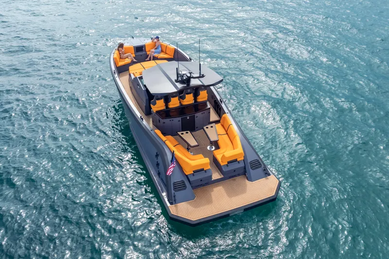 Slide: The Image of 2024 Lekker 44 boat with orange seating on blue water. - 8