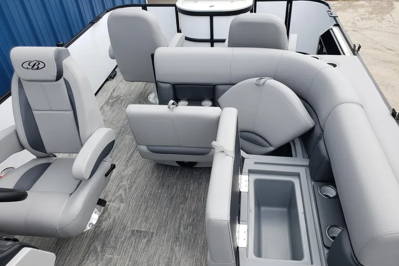 Slide: The Image of 2026 Bentley Pontoons Fish 223 N-Cruise interior with gray seating and storage compartments. - 15