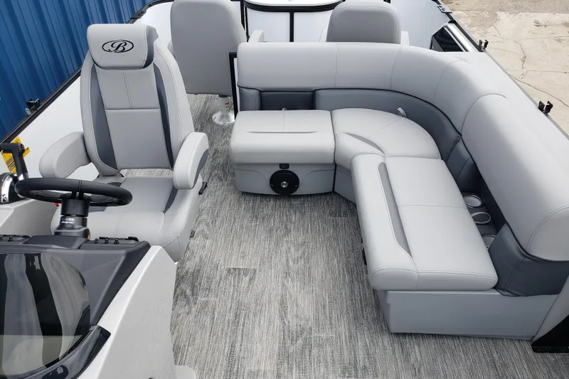 Slide: The Image of 2026 Bentley Pontoons Fish 223 N-Cruise interior with luxurious gray seating and steering console. - 16