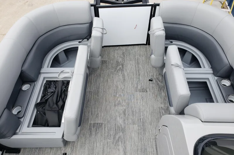 Slide: The Image of Interior of 2026 Bentley Pontoons Fish 223 N-Cruise with gray seating and storage compartments. - 18
