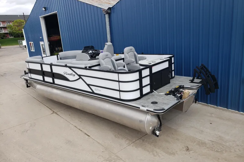 Slide: The Image of Manufacturer Provided Image: 2026 Bentley Pontoons Fish 223 N-Cruise floor plan, featuring spacious seating and helm layout. - 21