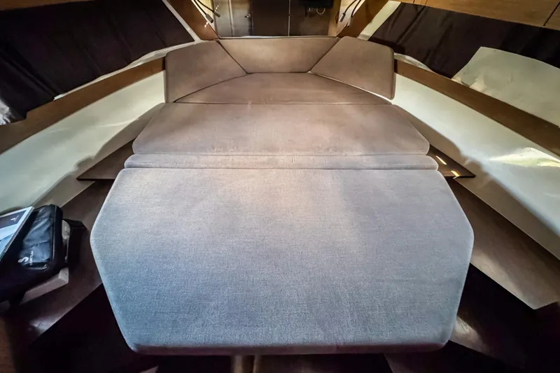 Slide: The Image of 2023 Beneteau Antares 11 interior cabin with comfortable seating and modern design. - 39