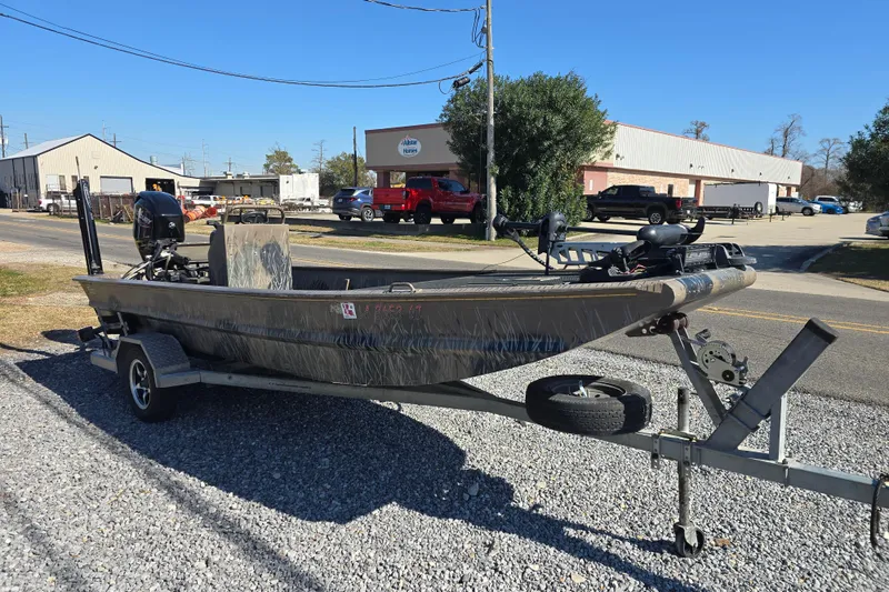 Slide: The Image of 2018 Pro-Drive 1754 boat on trailer in industrial area. - 5