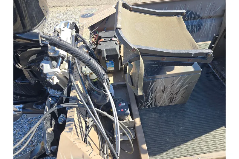 Slide: The Image of 2018 Pro-Drive 1754 boat interior with seat, wiring, and equipment. - 8