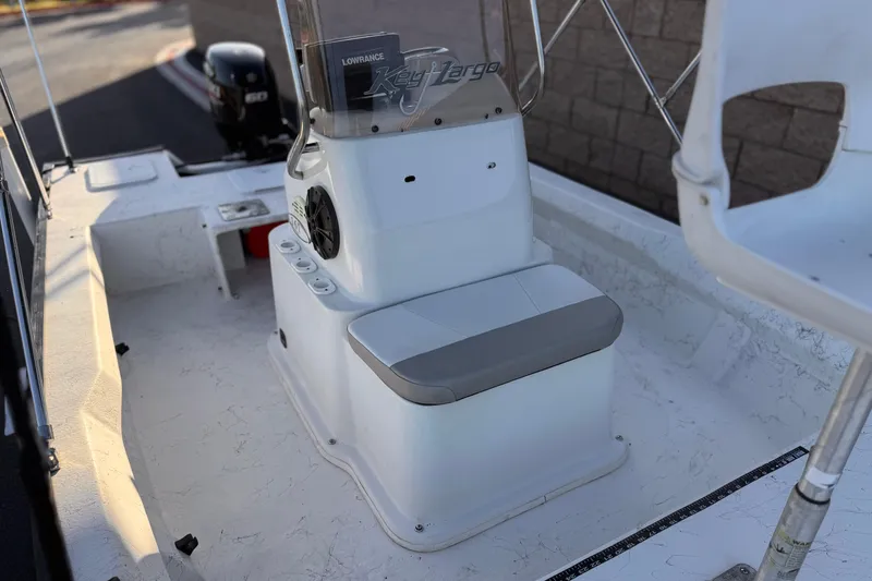 Slide: The Image of 2018 Caravelle Key Largo 161 boat interior with seating and control console. - 13