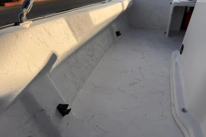 Slide: The Image of 2018 Caravelle Key Largo 161 boat interior with textured white surface. - 16