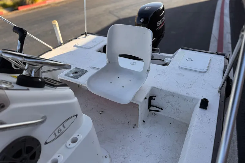 Slide: The Image of 2018 Caravelle Key Largo 161 boat interior with steering wheel and seat. - 17
