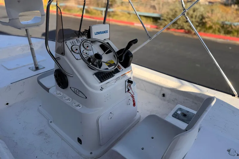 Slide: The Image of 2018 Caravelle Key Largo 161 boat console with steering wheel and controls. - 20