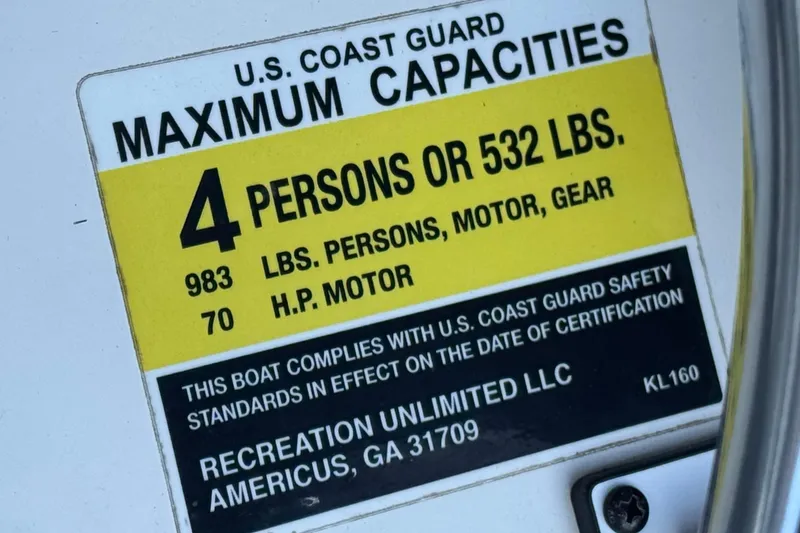 Slide: The Image of 2018 Caravelle Key Largo 161 capacity label, 4 persons or 532 lbs, 70 HP motor. - 23