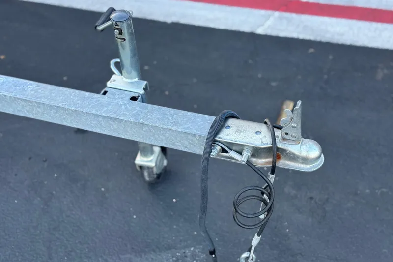Slide: The Image of Trailer hitch of a 2018 Caravelle Key Largo 161 on asphalt surface. - 24