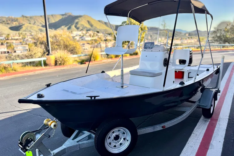 Slide: The Image of 2018 Caravelle Key Largo 161 boat on trailer, scenic background, sunny day. - 3