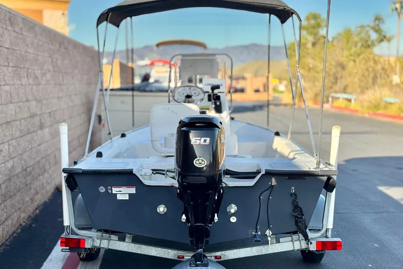 Slide: The Image of 2018 Caravelle Key Largo 161 boat with 50 HP outboard motor on trailer. - 4