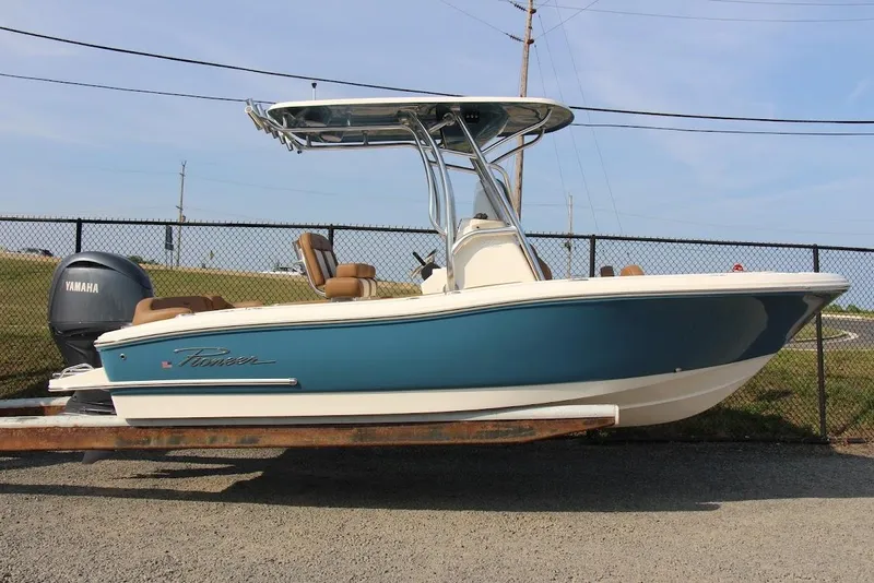The Image of 2025 Pioneer 202 Islander boat with Yamaha engine, blue and white design, parked outdoors. - 0