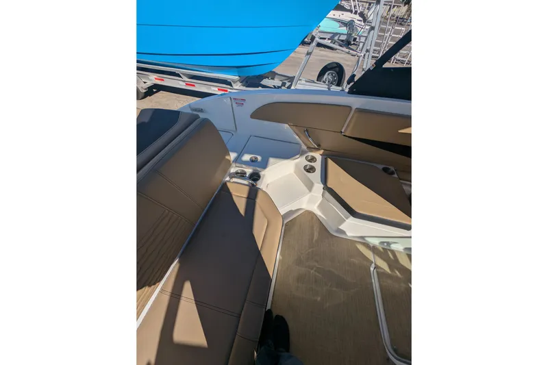 Slide: The Image of Interior view of 2021 Sea Ray 21 SPX OB boat with tan seating and cup holders. - 14